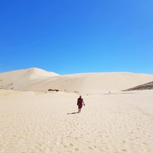 Woman at the Giant Sand Dunes in Cape Reinga, Northland, New Zealand